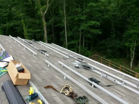 Mounting the racks to the home's roof.